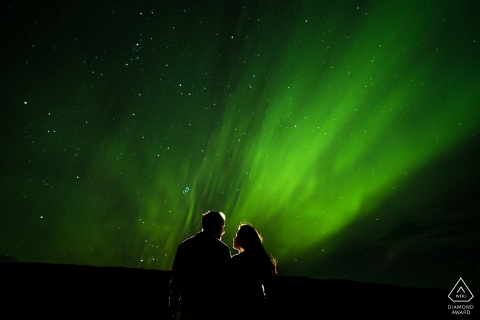 Mumbai engagement images of a couple with a green sky and stars  | India photographer pre-wedding session