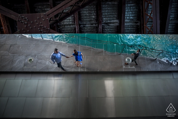 Photo by: <a href="https://www.wpja.com/photos/diamond-award-top-wedding-engagement-photographer/2293296">Penny McCoy - Columbia Heights Minnesota reflection under bridge of this couple in their MN engagement portrait session