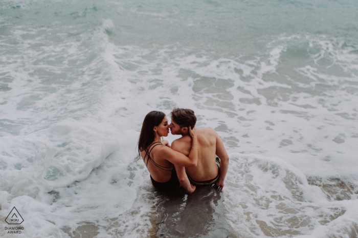 Photo by: <a href="https://www.wpja.com/photos/diamond-award-top-wedding-engagement-photographer/2301751">Monika Zaldo - Zaldibia Guipuzcoa Ocean waves pre-wedding engagement pictures of a couple at the beach | Biscay portrait shoot