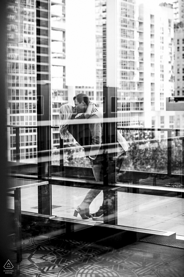 Chicago Urban Engagement Session with a couple and tall buildings in black and white