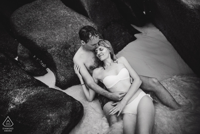 Photo by: <a href="https://www.wpja.com/photos/diamond-award-top-wedding-engagement-photographer/2291111">Monique De Caro - Viersen Black and white wedding photographer engagement portrait of a couple on the rocks in the water | NRW pre-wedding pictures