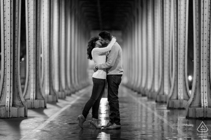 Photo by: <a href="https://www.wpja.com/photos/diamond-award-top-wedding-engagement-photographer/2287641">Simon Cassanas - Paris France engagement pictures of a couple with bridge pillars | Paris photographer pre-wedding shoot with photographer