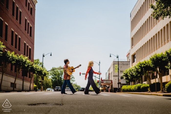 Walking along the street in GA during urban engagement shoot for portraits Walking along the street in GA during urban engagement shoot for portraits