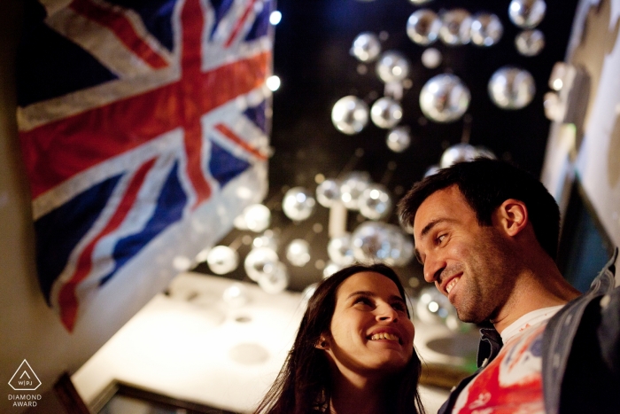 Braga engagement photos of a couple with flags and lights | Portugal photographer pre-wedding portrait session