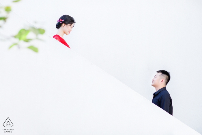 China engagement photos of a couple on white stairs | Fujian photographer pre-wedding portrait session