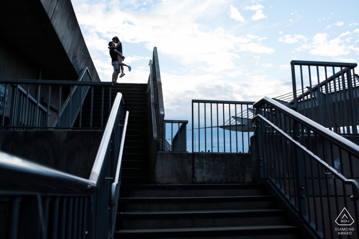 Australia pre-wedding engagement pictures of a couple hugging near stairs and rails  | Melbourne couple photography session