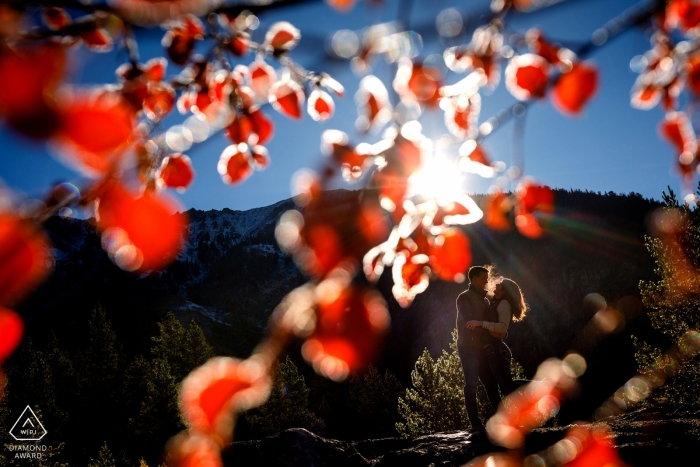 Photo by: <a href="https://www.wpja.com/photos/diamond-award-top-wedding-engagement-photographer/2351336">Trent Gillespie - Silverthorne Colorado Fall engagement portrait of a couple in trees near Copper Mountain in CO.