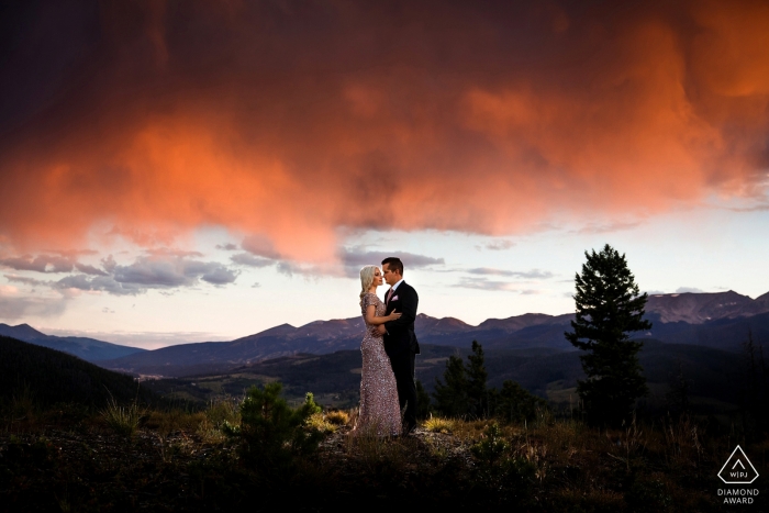 Photo by: <a href="https://www.wpja.com/photos/diamond-award-top-wedding-engagement-photographer/2351341">Trent Gillespie - Silverthorne Colorado Engagement photos on top of a mountain near Breckenridge, CO.
