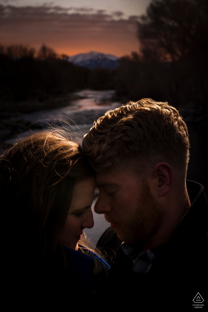 The Colorado couple pictured in warm tones of rim light in Boulder