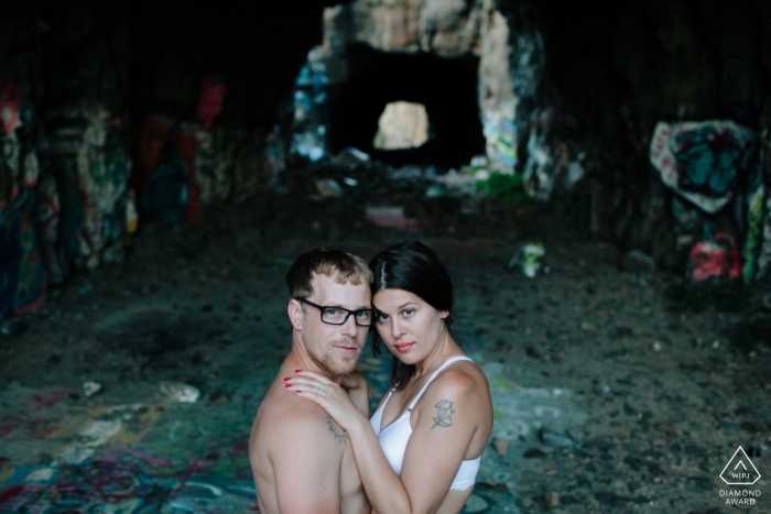 The Washington engaged couple is posing the cavernous graffiti-filled ruins