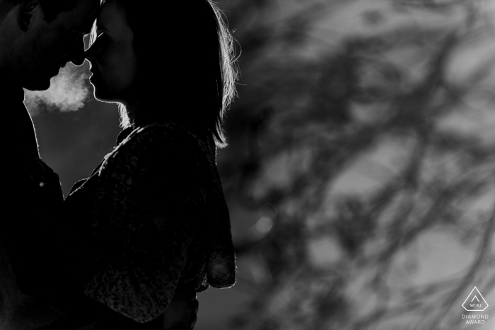 Alberta engaged couple's picture session, with their cold winter breath showing in the air