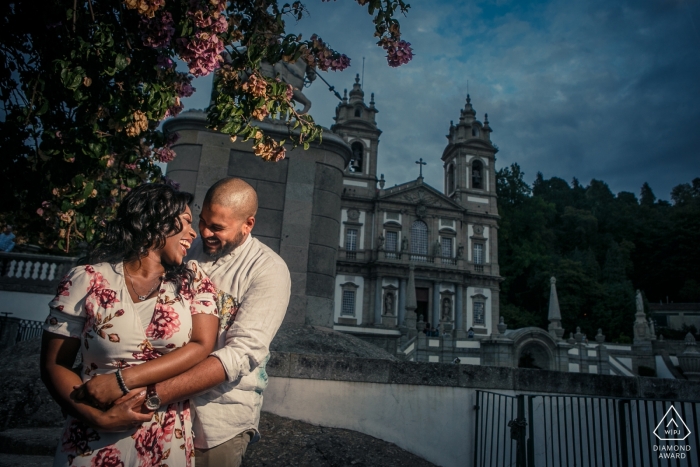 A Lisbon couple's intimate embrace near the grand palace