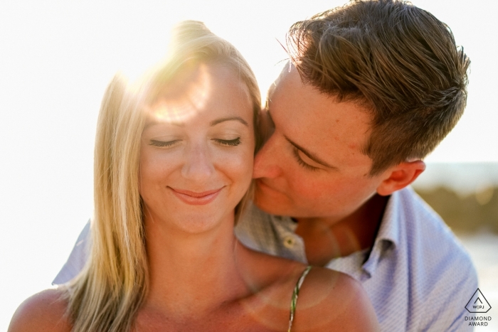 Jalisco couple embracing in the sunshine for a tight engagement portrait shoot