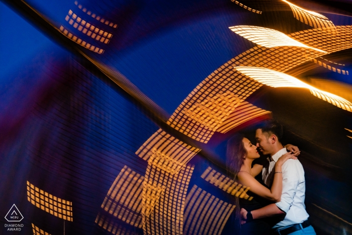 Ho Chi Minh engaged couple's embrace under the lights