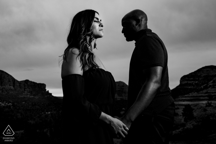 The Arizona engaged couple's profiles are captured in the desert in BW