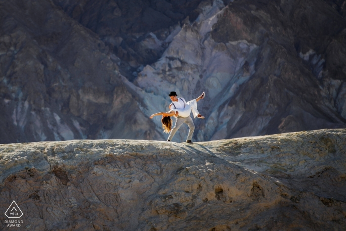 California wedding engagement session in the desert hills for a dancing, dipping couple