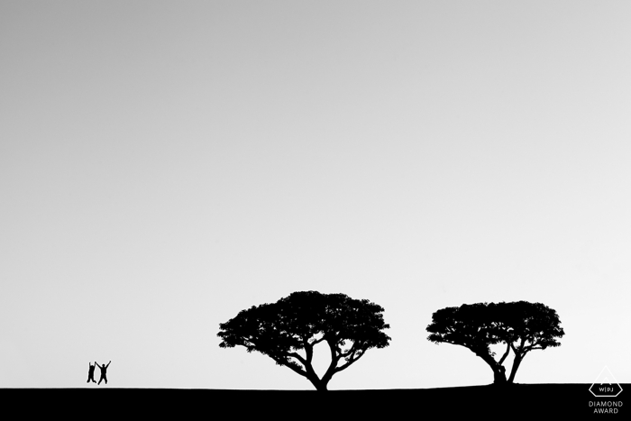 The California couple is jumping and celebrating their love near two majestic trees