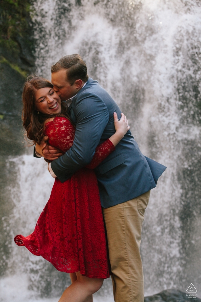 Embracing Tennessee couple amidst the beauty of the rushing waterfall