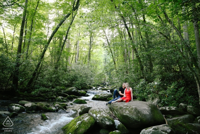 Picture of a couple from Tennessee, in a tranquil setting of a creekside oasis