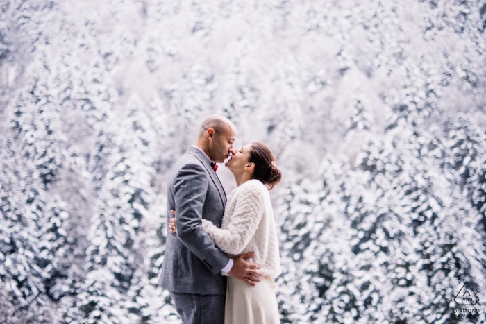 Pyrenées - Couple Kissing in a snow forest - Engagement Photographer