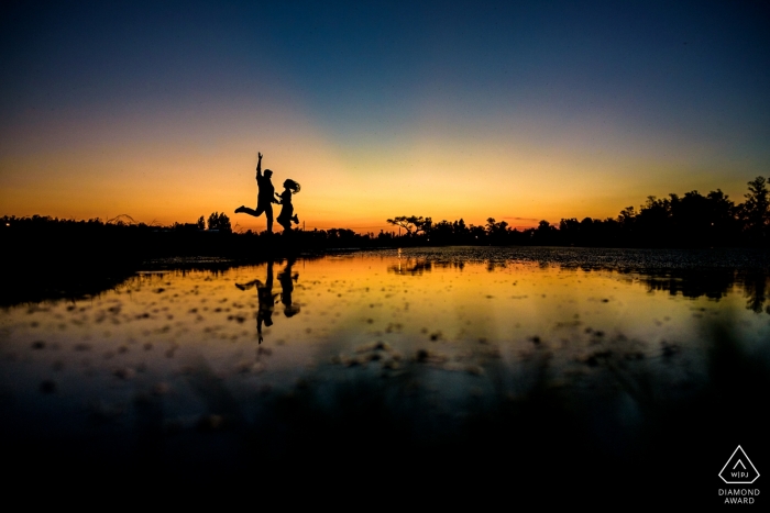 Carcaraña, Argentina Engagement Photo | jump at sunset!