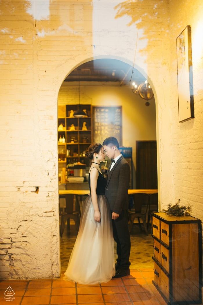 Fujian, China Pre-Wedding Engagement Portrait of a couple through reflecting glass