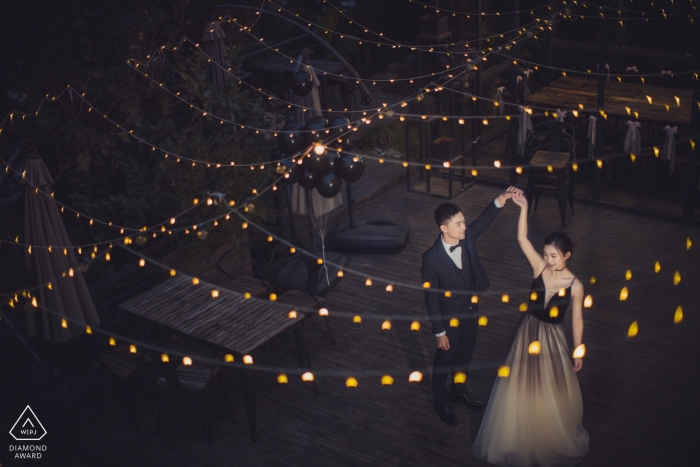 Photo by: <a href="https://www.wpja.com/photos/diamond-award-top-wedding-engagement-photographer/2423931">Joy Qin - Longyan Fujian, China Pre-Wedding Engagement Portraits with strings of lights