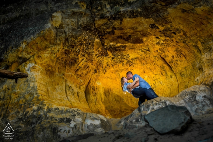 Photo by: <a href="https://www.wpja.com/photos/diamond-award-top-wedding-engagement-photographer/2424381">Penny McCoy - Columbia Heights Minnesota Having fun in the cave with a couple | Minneapolis Engagement Photographer