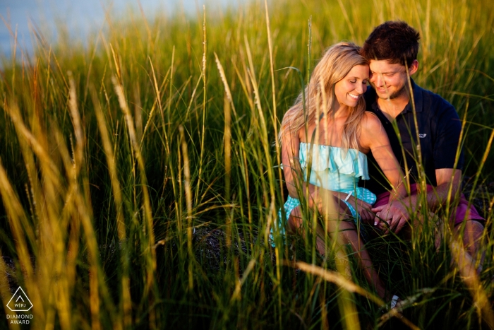 Photo by: <a href="https://www.wpja.com/photos/diamond-award-top-wedding-engagement-photographer/2424121">Kevin Trimmer - Providence Rhode Island South Dartmouth, Massachusetts | Couple amongst sea grass at the beach in the sun