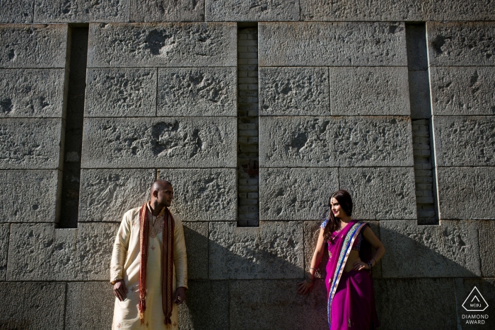 Couple against wall in Boston Boston, Massachusetts engagement portrait | Couple against wall