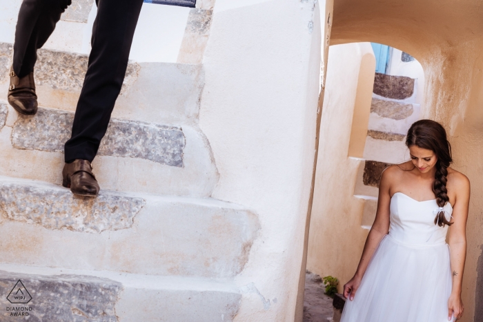 Santorini, Greece Pre Wedding Portraits on the stucco steps Santorini, Greece Pre Wedding Portraits on the stucco steps