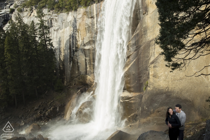 Photo by: <a href="https://www.wpja.com/photos/diamond-award-top-wedding-engagement-photographer/2420556">Ian Chin - San Francisco California yosemite falls Engagement Photo session with couple and waterfall