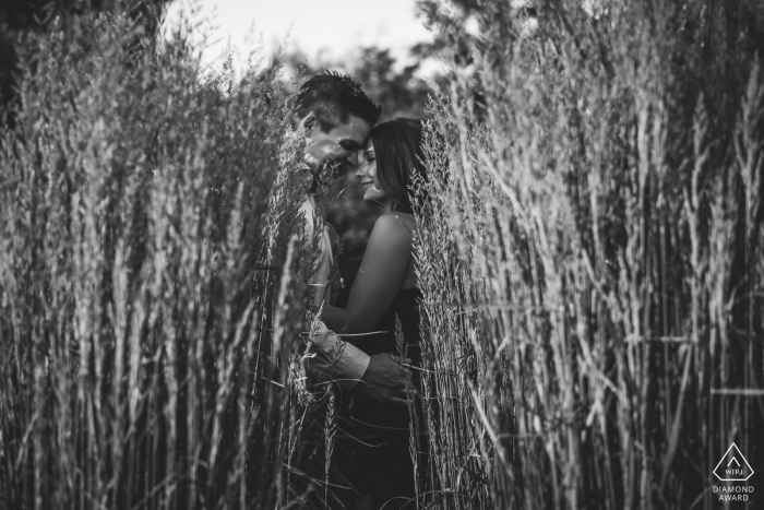 Edmonton, AB, Canada engaged couple hiding during portrait session