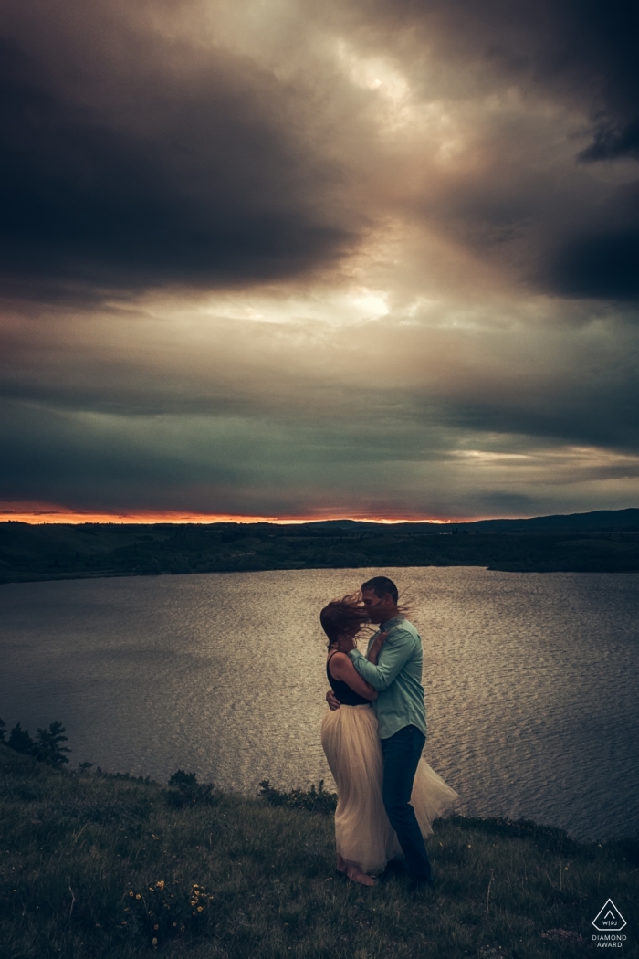 Photo by: <a href="https://www.wpja.com/photos/diamond-award-top-wedding-engagement-photographer/2418681">Dorota Karpowicz - Edmonton Alberta Waterton Lakes National Park, AB, Canada | Windy Sunrise Portraits at the Water