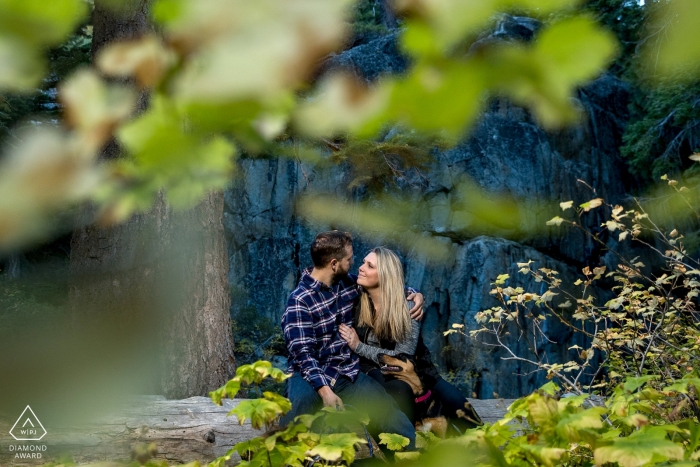 Photo by: <a href="https://www.wpja.com/photos/diamond-award-top-wedding-engagement-photographer/2420476">Kevin Sawyer - Lake Tahoe California Emerald Bay, Lake Tahoe Engagement Portraits | Through the Leaves | Couple in Love