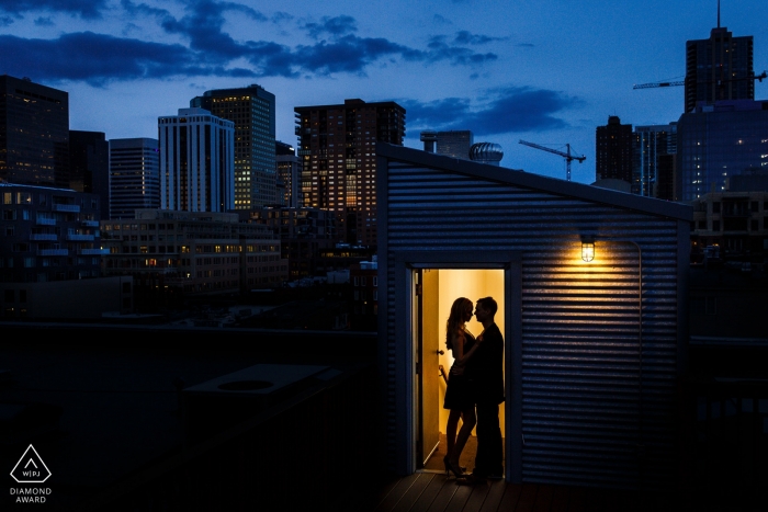 Photo by: <a href="https://www.wpja.com/photos/diamond-award-top-wedding-engagement-photographer/2422201">Trent Gillespie - Silverthorne Colorado Denver, Colorado Portraits | A silhouette of a beautiful couple against the Denver Skyline at night.