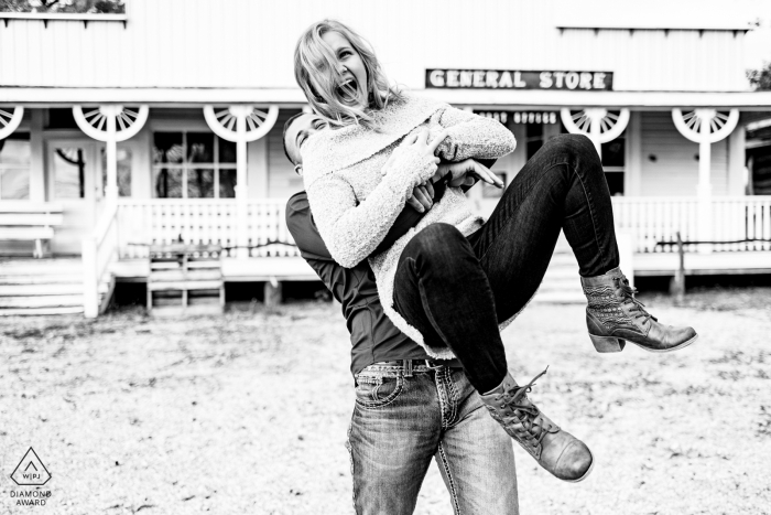  Kansas wedding engagment image in black and white | Merian, KS Engaged couple playing together 