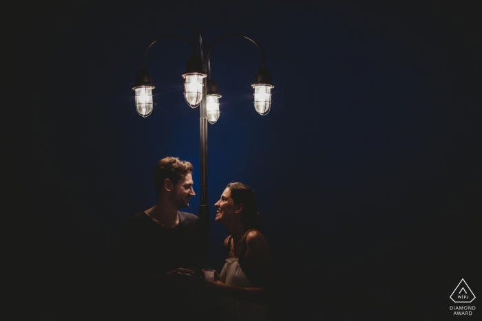 Photo by: <a href="https://www.wpja.com/photos/diamond-award-top-wedding-engagement-photographer/2424946">Emre Nesli - Mersin Mersin Chatting under the street lights - Mersin Engagement Photoshoot with Couple