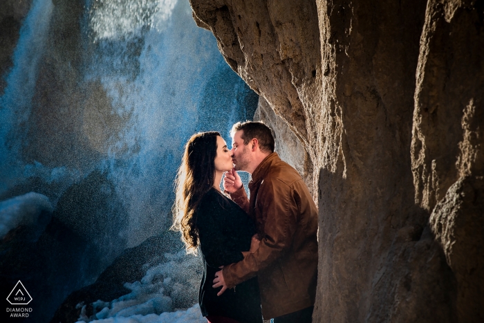Photo by: <a href="https://www.wpja.com/photos/diamond-award-top-wedding-engagement-photographer/2424786">Jesse La Plante - Boulder Colorado Rifle Falls Engagement | Colorado Wedding Photo Session | Bride and Groom kissing under waterfall