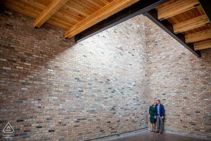 Photo by: <a href="https://www.wpja.com/photos/diamond-award-top-wedding-engagement-photographer/2428416">Victoria Sprung - Chicago Illinois high wall portrait with couple - Illinois Engagement Photographer