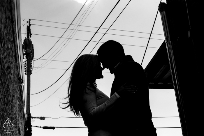 Photo by: <a href="https://www.wpja.com/photos/diamond-award-top-wedding-engagement-photographer/2426951">Janine Cooper - Omaha Nebraska omaha engagement session - urban silhouette on the streets with powerlines