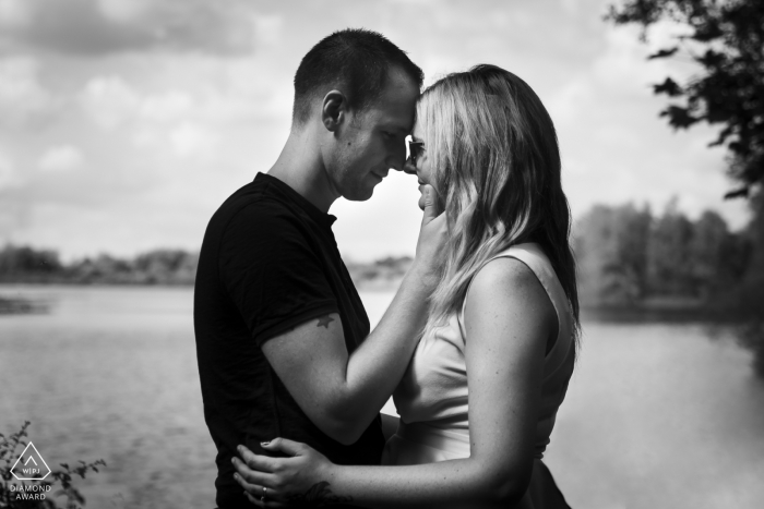 Stanwick Lakes, Northamptonshire pre-wedding portrait in black-and-white face-to-face at the lake