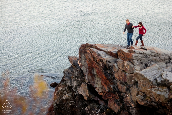Photo by: <a href="https://www.wpja.com/photos/diamond-award-top-wedding-engagement-photographer/2429116">Kevin Trimmer - Providence Rhode Island Couple on cliffs - Rhode Island Engagement Photo