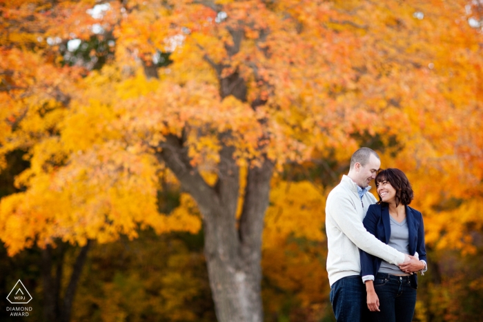 Photo by: <a href="https://www.wpja.com/photos/diamond-award-top-wedding-engagement-photographer/2429131">Kevin Trimmer - Providence Rhode Island couple with colorful tree in New England - Rhode Island Engagement Photographer