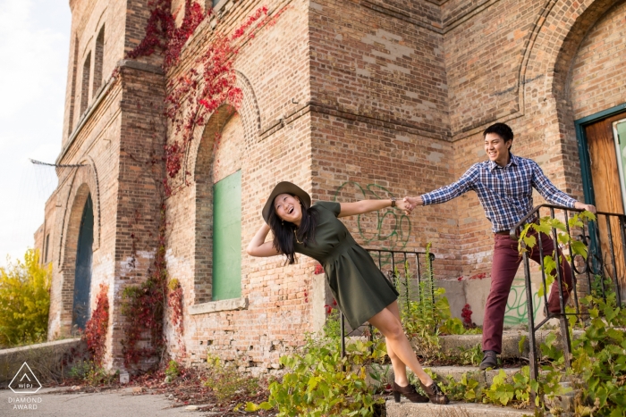 Photo by: <a href="https://www.wpja.com/photos/diamond-award-top-wedding-engagement-photographer/2425321">Romulo Morishita - Madison Wisconsin Playful couple at abandoned building - Wisconsin Engagement Session
