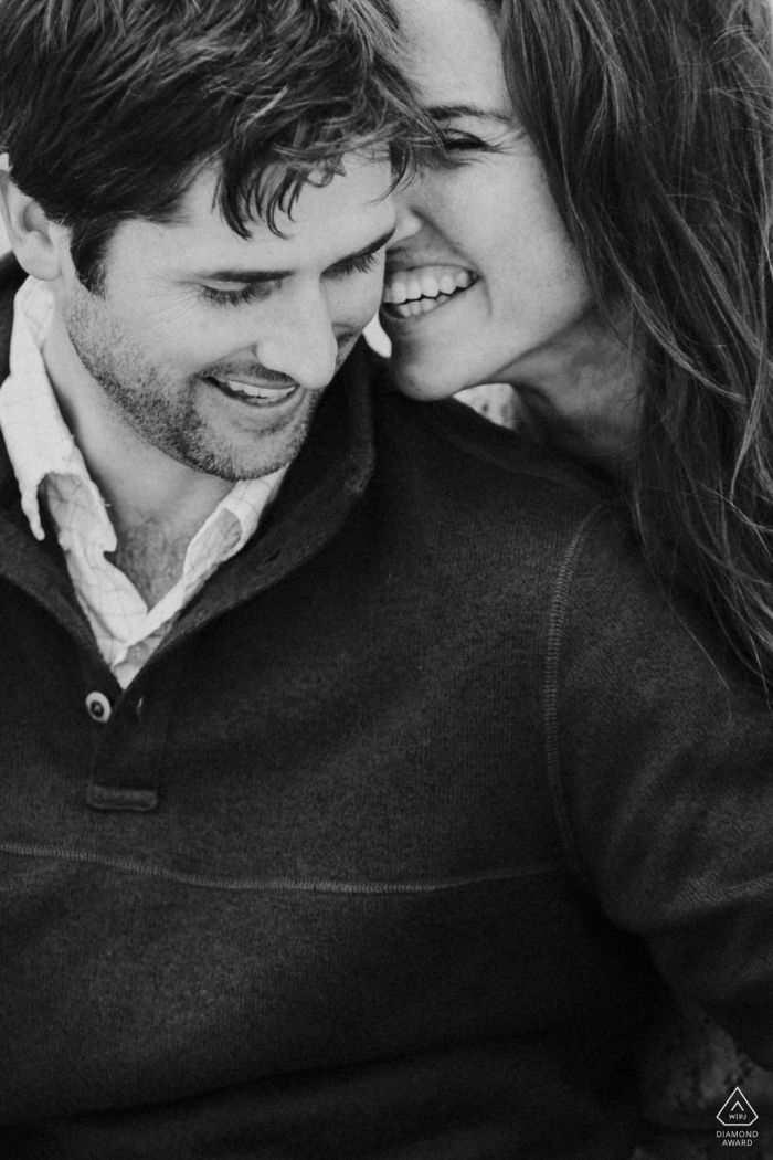Photo by: <a href="https://www.wpja.com/photos/diamond-award-top-wedding-engagement-photographer/2426751">Raymond Nguyen - Sacramento California Vertical portrait of a young newly engaged couple laughing in black-and-white