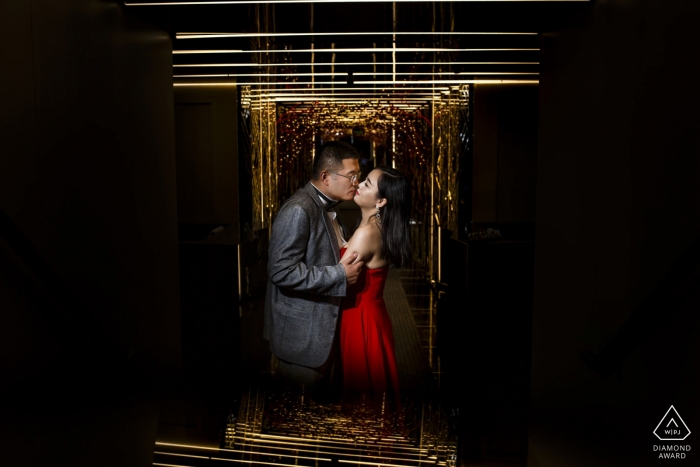 Photo by: <a href="https://www.wpja.com/photos/diamond-award-top-wedding-engagement-photographer/2427981">Ufuk Sarisen - Istanbul Istanbul engagement shooting photo with red dress indoors