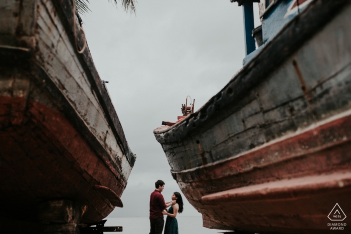 Photo by: <a href="https://www.wpja.com/photos/diamond-award-top-wedding-engagement-photographer/2441706">Tam Nguyen - Hoi An This portrait was taken at Hoi An between two fishing boats at the sea