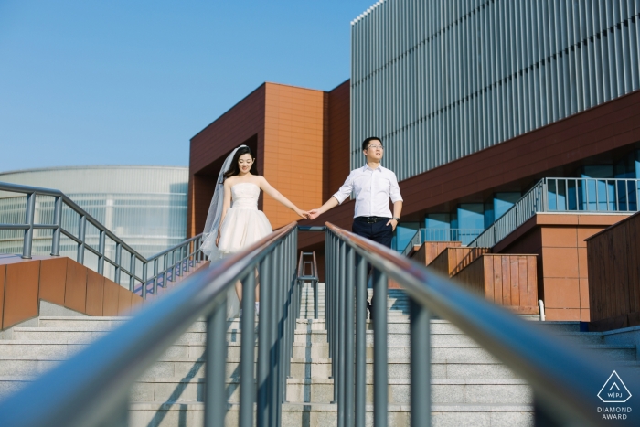 Photo by: <a href="https://www.wpja.com/photos/diamond-award-top-wedding-engagement-photographer/2434391">Yifan Liu - Binhai New Area TianJin Summer prewedding portrait photo shoot session on the stairs with hand rails