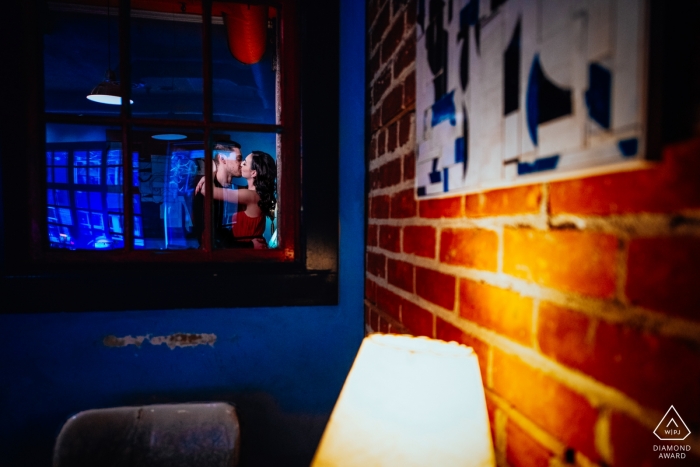 Edmonton, AB, Canada engagement portrait photographer - kissing in the indoor Café